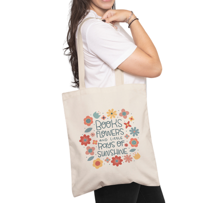 Books , flowers and rays of sunshine tote bag